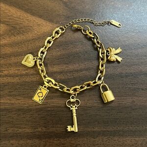 Gold plated stainless steel multi charm bracelet